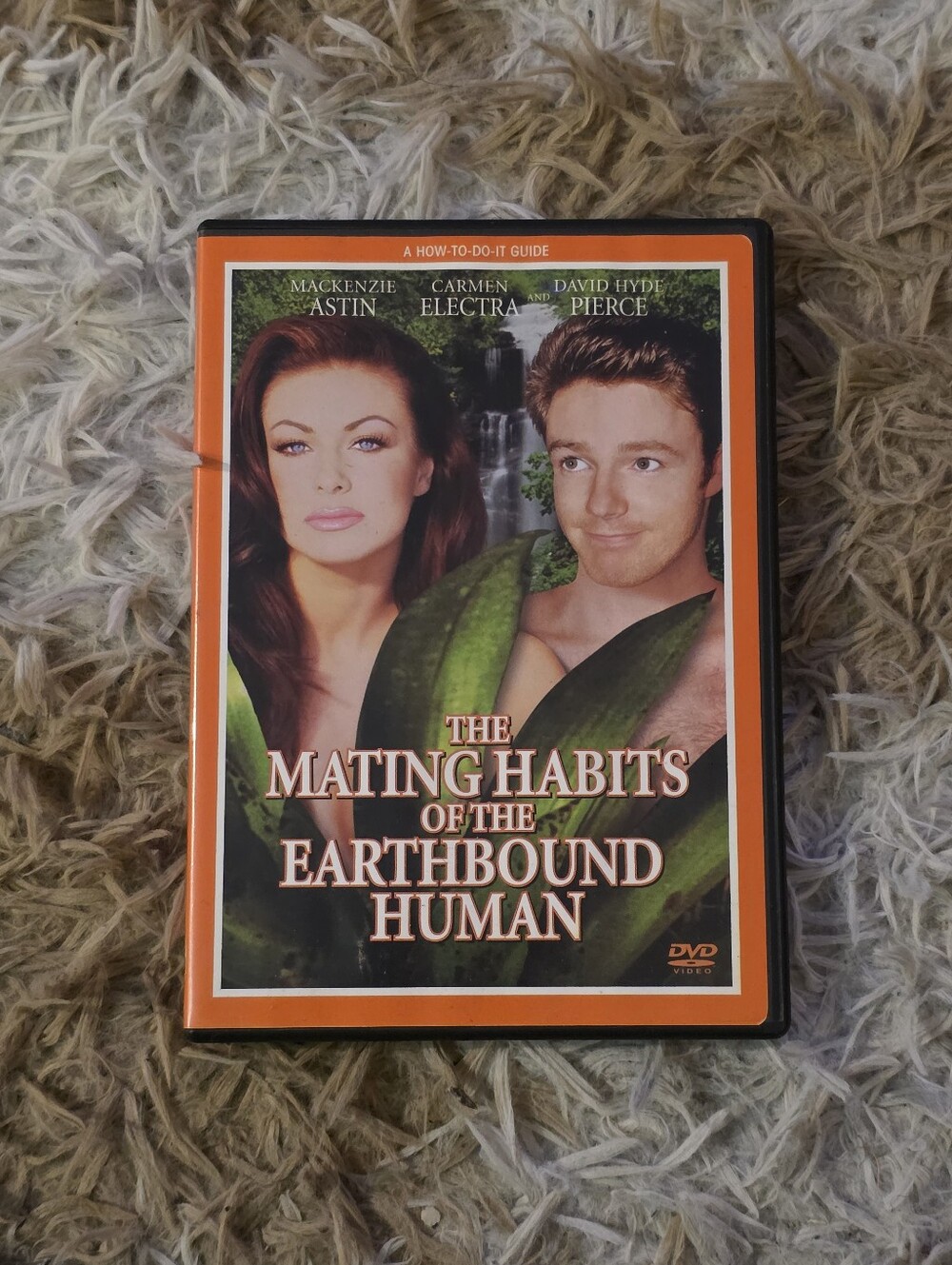 The Mating Habits of the Earthbound Human DVD - Orange Cover